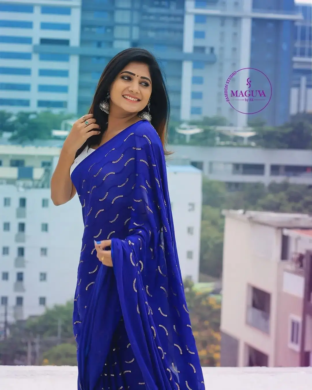 Vasanthi Krishnan Wearing Blue Saree White Sleeveless Blouse